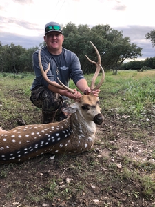 Jacob Adams with his Axis buck taken on a Safari Style Hunt.