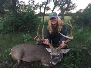 Annie Lone of Colorado with her awesome 158 Inch 9 point Buck!