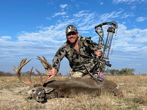 Bryan S. with his 158 Inch 14 point taken with a Bow!