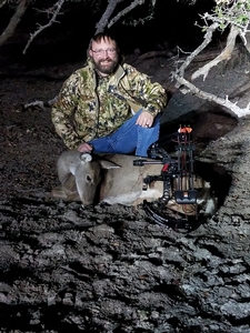 Travis Gaspard with his doe. First animal taken with a bow!