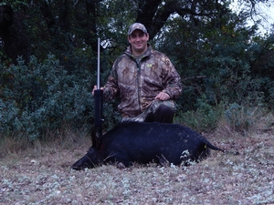 Ivey with his pig taken on the hunt.