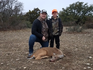 Craig enjoying the hunt with his son Cooper.