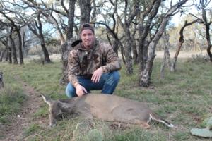 Jake Corley with his doe and first whitetail ever.