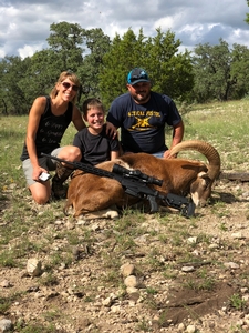 Easton with his Mom and Dad, celebrating a great hunt for his Red Sheep Ram.