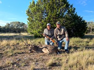 Jeremy Celebrating his buck with his son Parker.