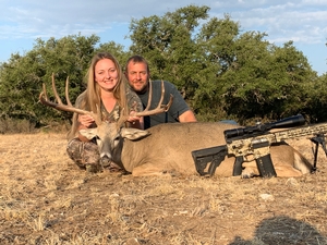 Brittanys first ever deer with her fiance Bobby.