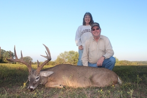 Bill celebrating his great buck with wife Lori.