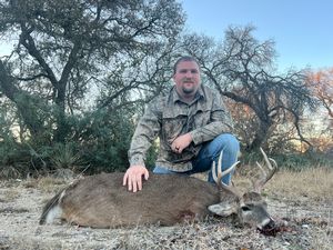 Garrett B. with his cull buck.