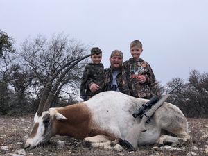 Cody celebrating his Oryx with his 2 boys.