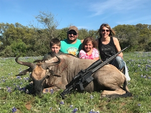 Jesse celebrating his wildebeest with the family.