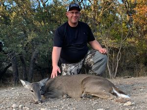 Chris M. With his first whitetail doe of the trip.